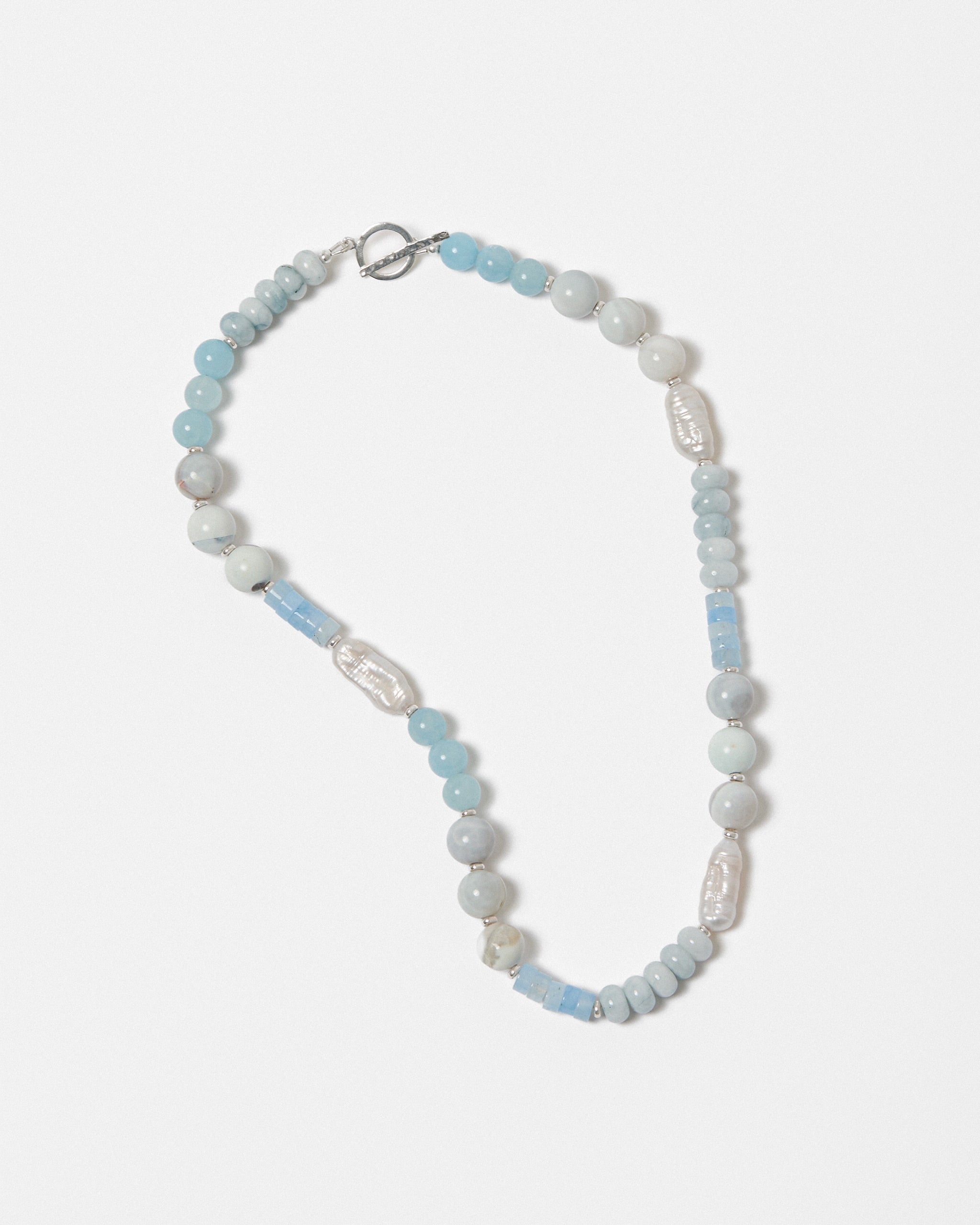 Necklace with blue and white beads on a white background