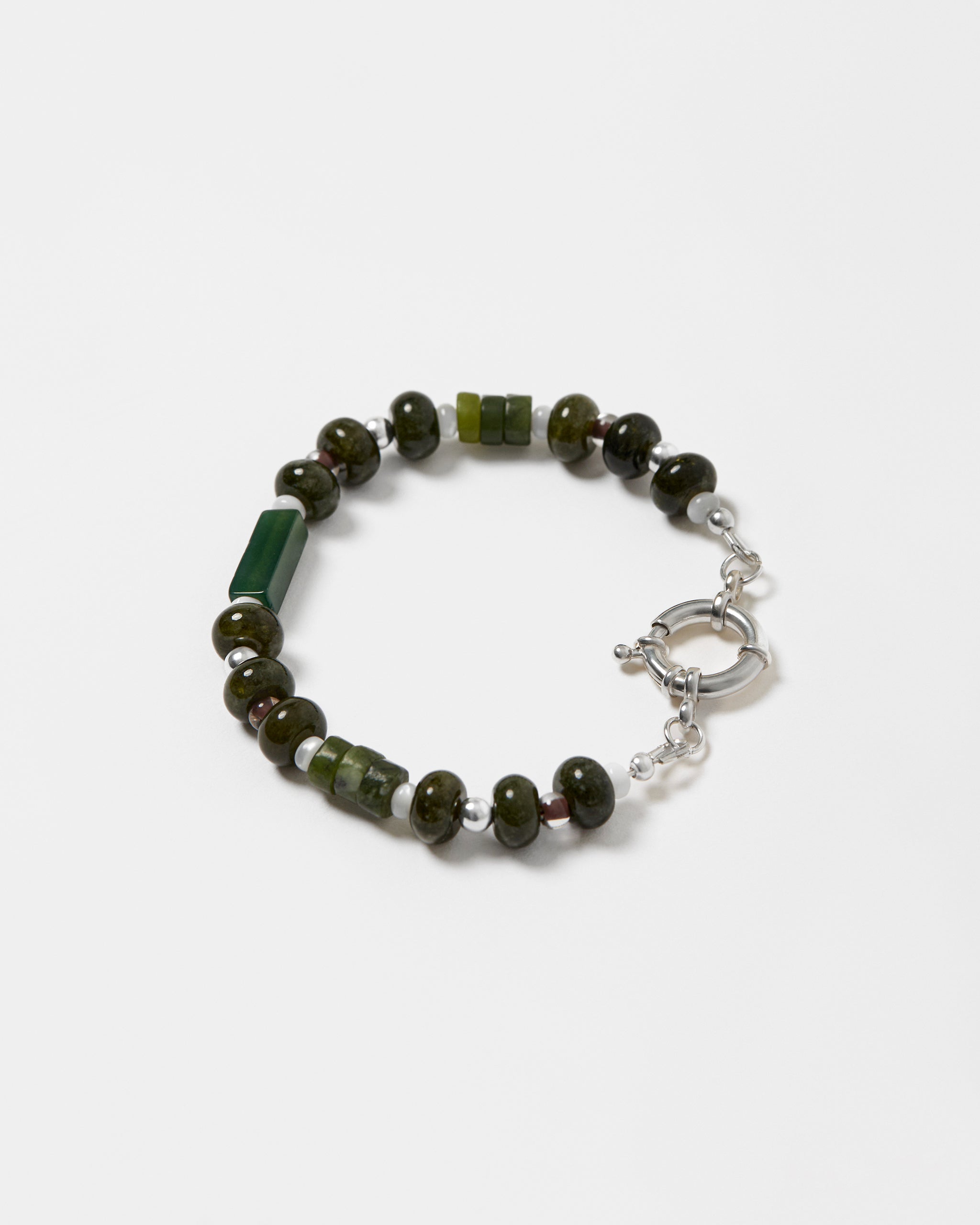 Bracelet with green and brown beads on a white background