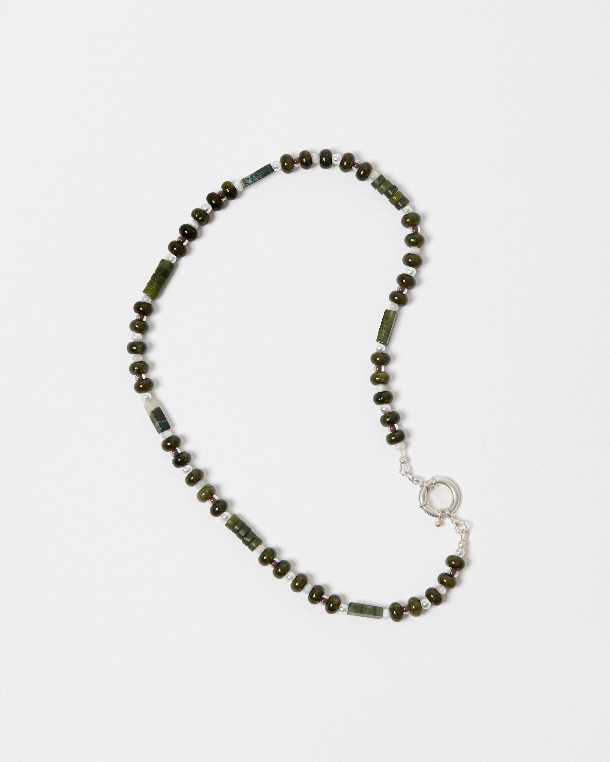 Necklace with green beads on a white background