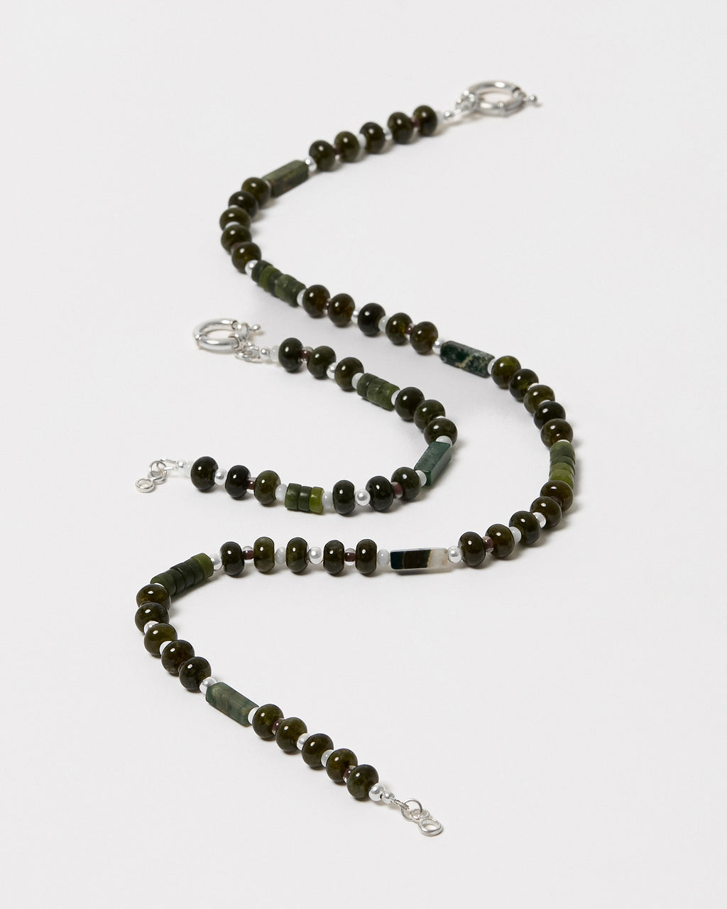Necklace with green and brown beads on a white background