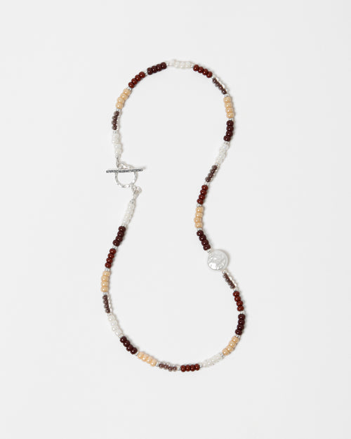 Necklace with multicolored beads on a white background