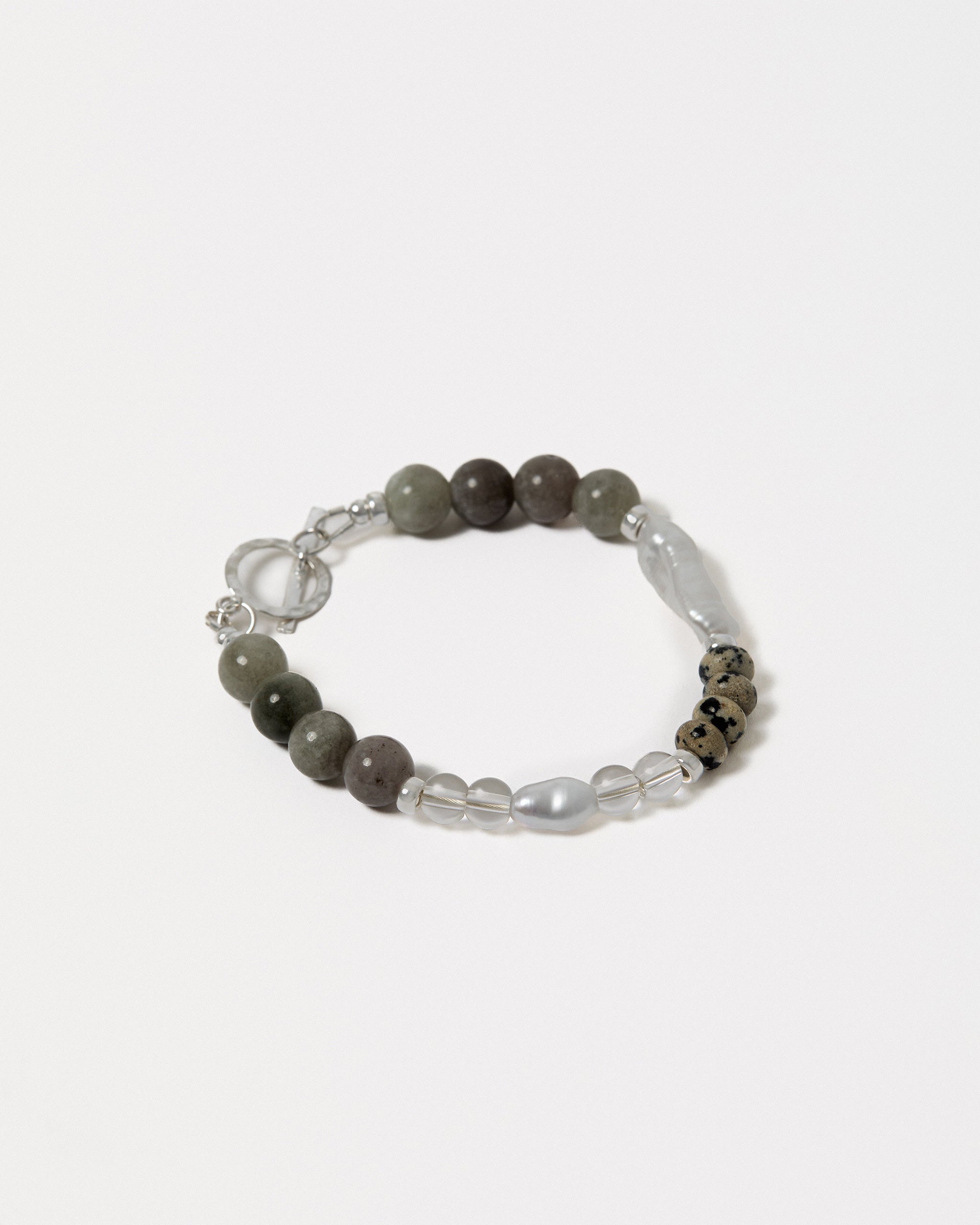Beaded bracelet with gray and clear beads on a white background
