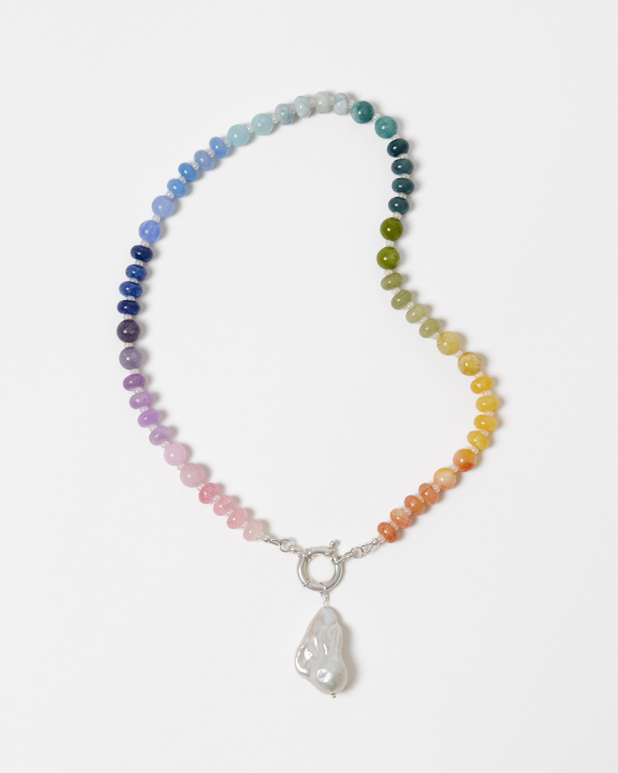 Multicoloured beaded necklace with a freshwater pearl pendant on a white background