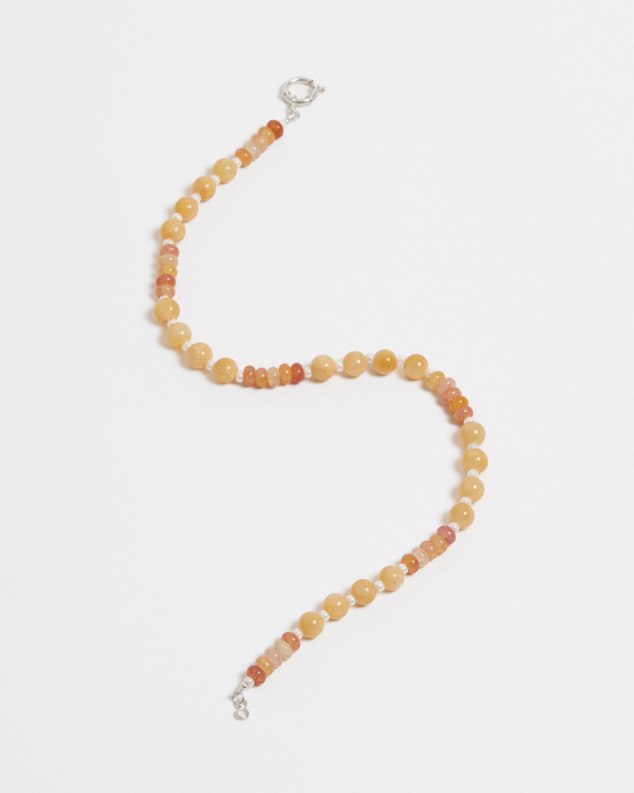 Necklace with multicolored beads on a white background