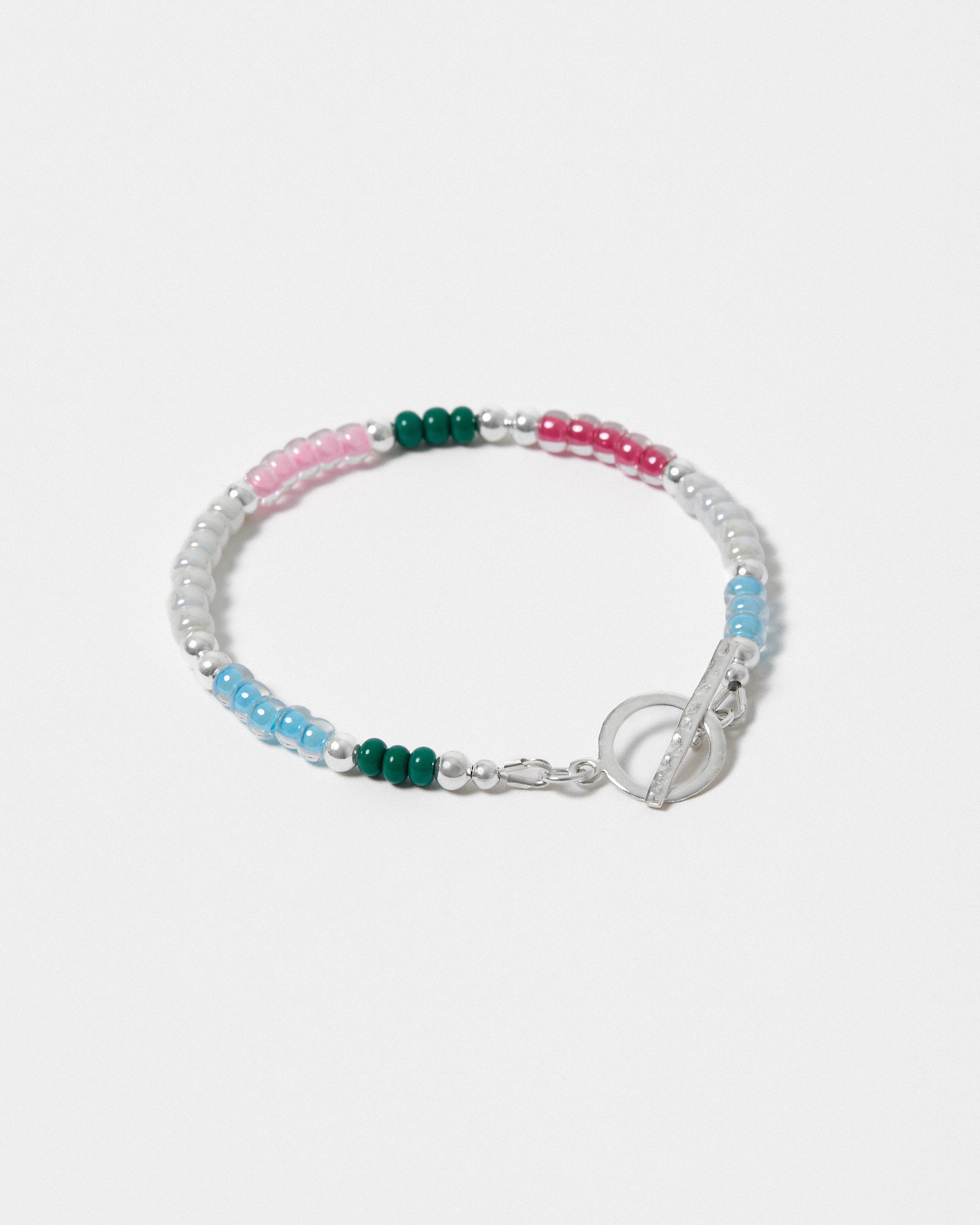 Beaded bracelet with pink, green, and blue beads on a white background