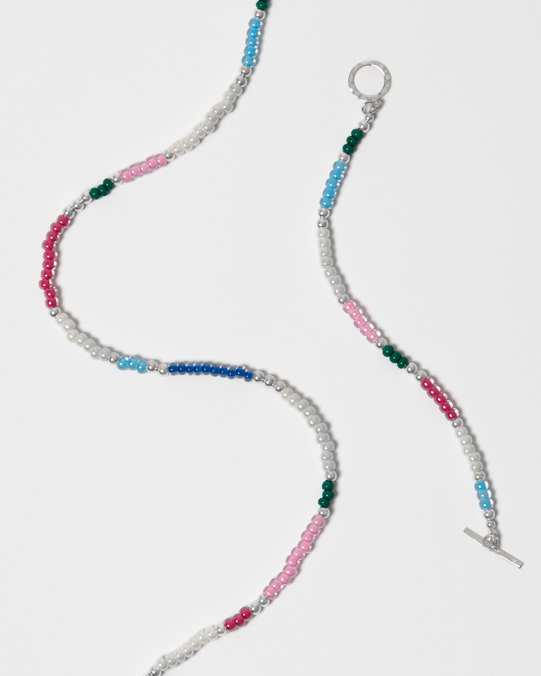 Beaded jewellery with multicolour beads on a white background